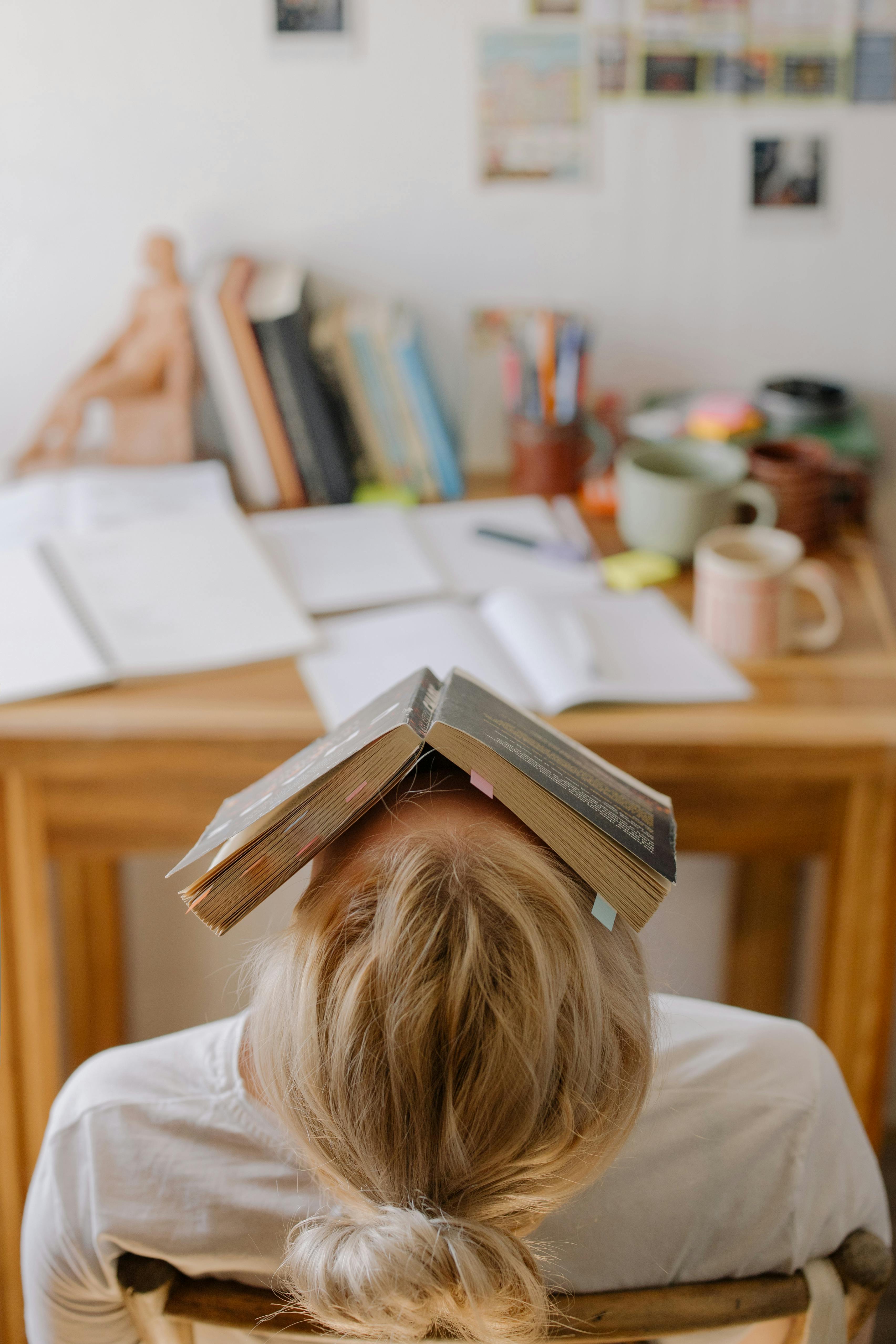 Student feeling frustrated and overwhelmed with study materials before receiving help from expert online GCSE Maths tutors