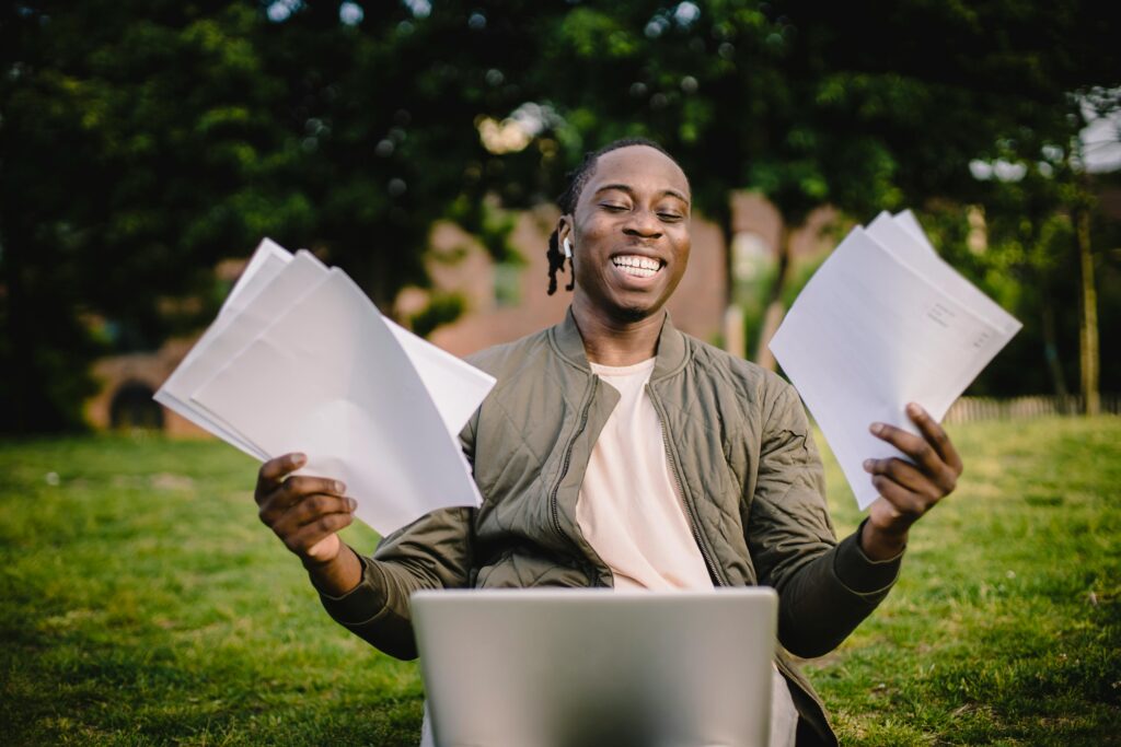 Successful student celebrating high grades in GCSE English exams