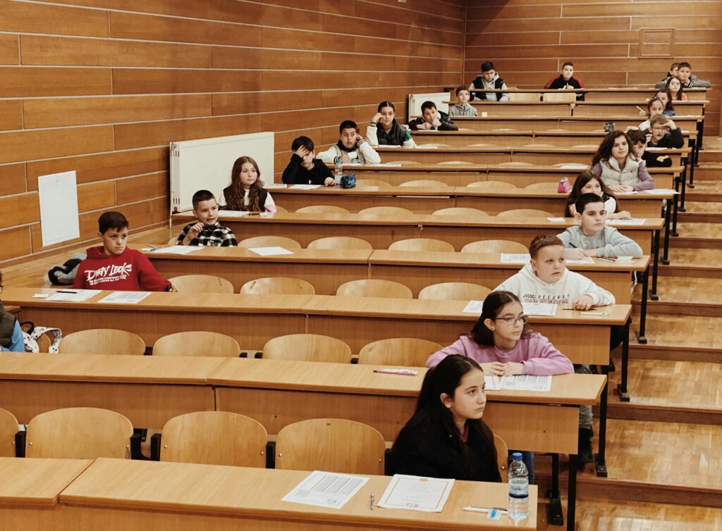 Group of students in an exam hall following their session with their expert Online GCSE Maths tutors.